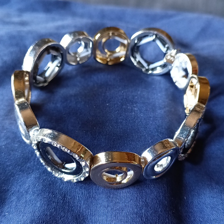 Nine West Silver And Gold Tone Grommets With Four Rhinestone Accents Bracelet.